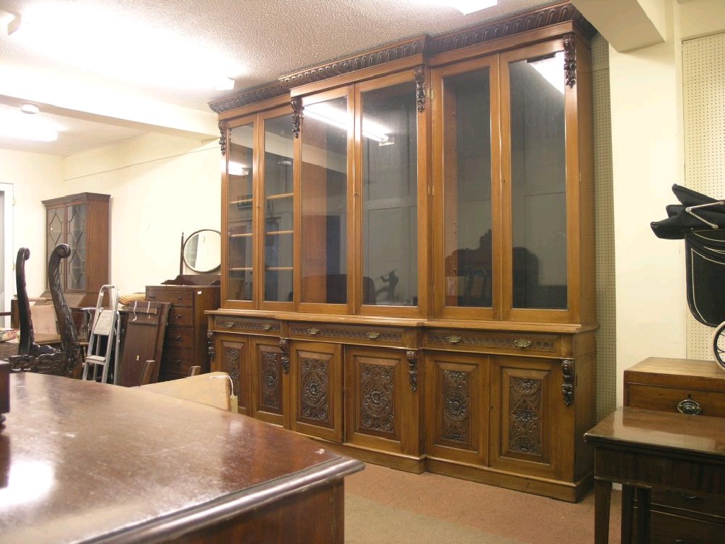 Appraisal: A large Victorian mahogany break fronted library bookcase gadrooned cornice