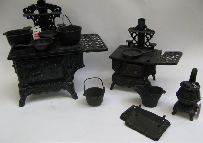 Appraisal: THREE PAINTED BLACK TOY ITEMS AND ACCESSORIES One is a