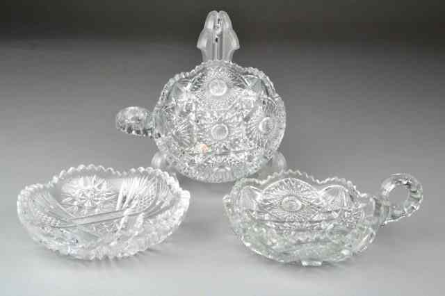 Appraisal: THREE CUT GLASS CANDY DISHESTwo dishes with a handle one