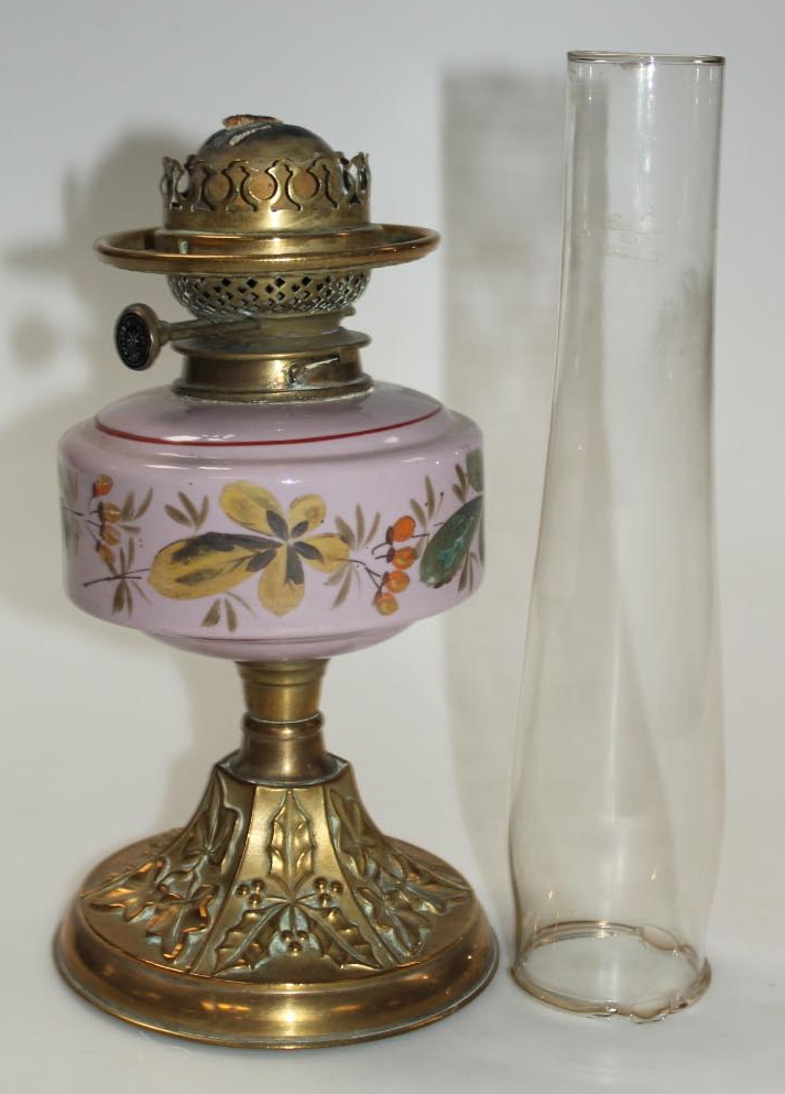 Appraisal: An Edwardian brass oil lamp with clear glass funnel and