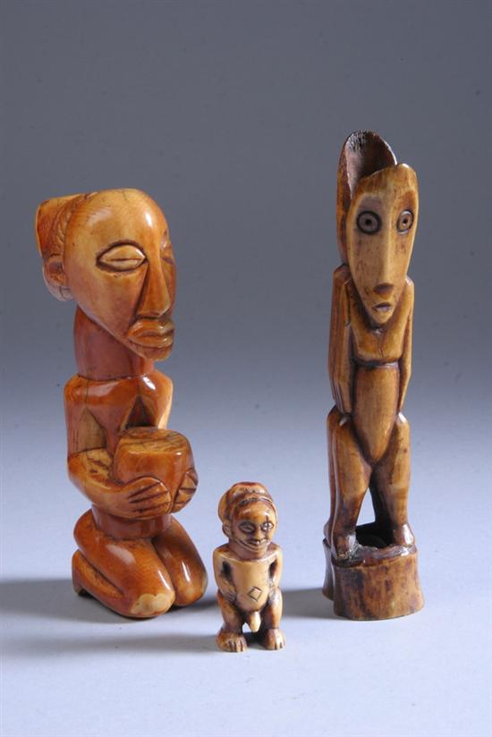 Appraisal: TWO AFRICAN IVORY FIGURES Possibly Bahemba One kneeling holding large