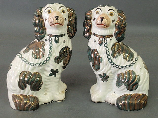 Appraisal: Pair of Staffordshire copper luster and white seated spaniels h