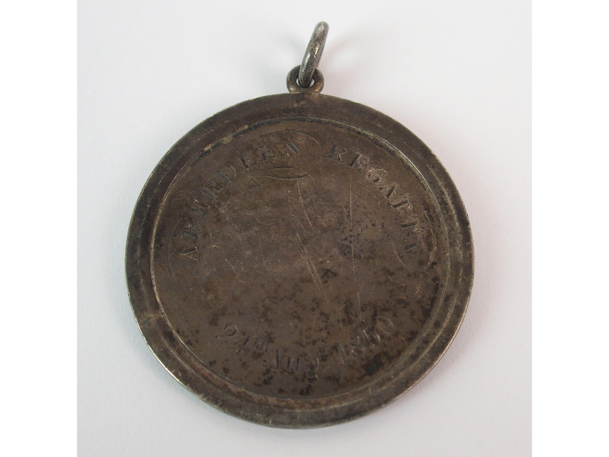 Appraisal: An Aberdeen silver Rowing prize medalwith ring suspension OBV engraved