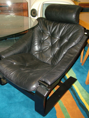 Appraisal: A leather wood cantilevered lounge chair c probably Scandinavian the