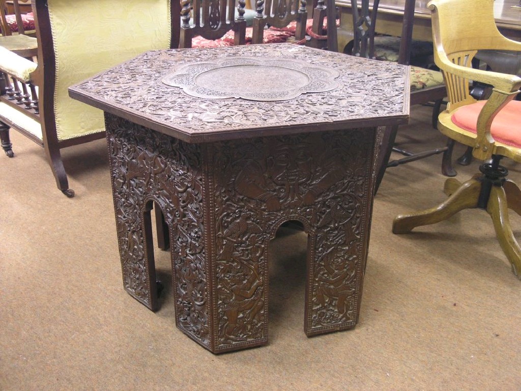 Appraisal: An unusally large Burmese carved hardwood centre table hexagonal shape