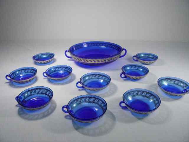 Appraisal: Czechoslovakian gilt cobalt blue glass bowl and cups Includes eleven