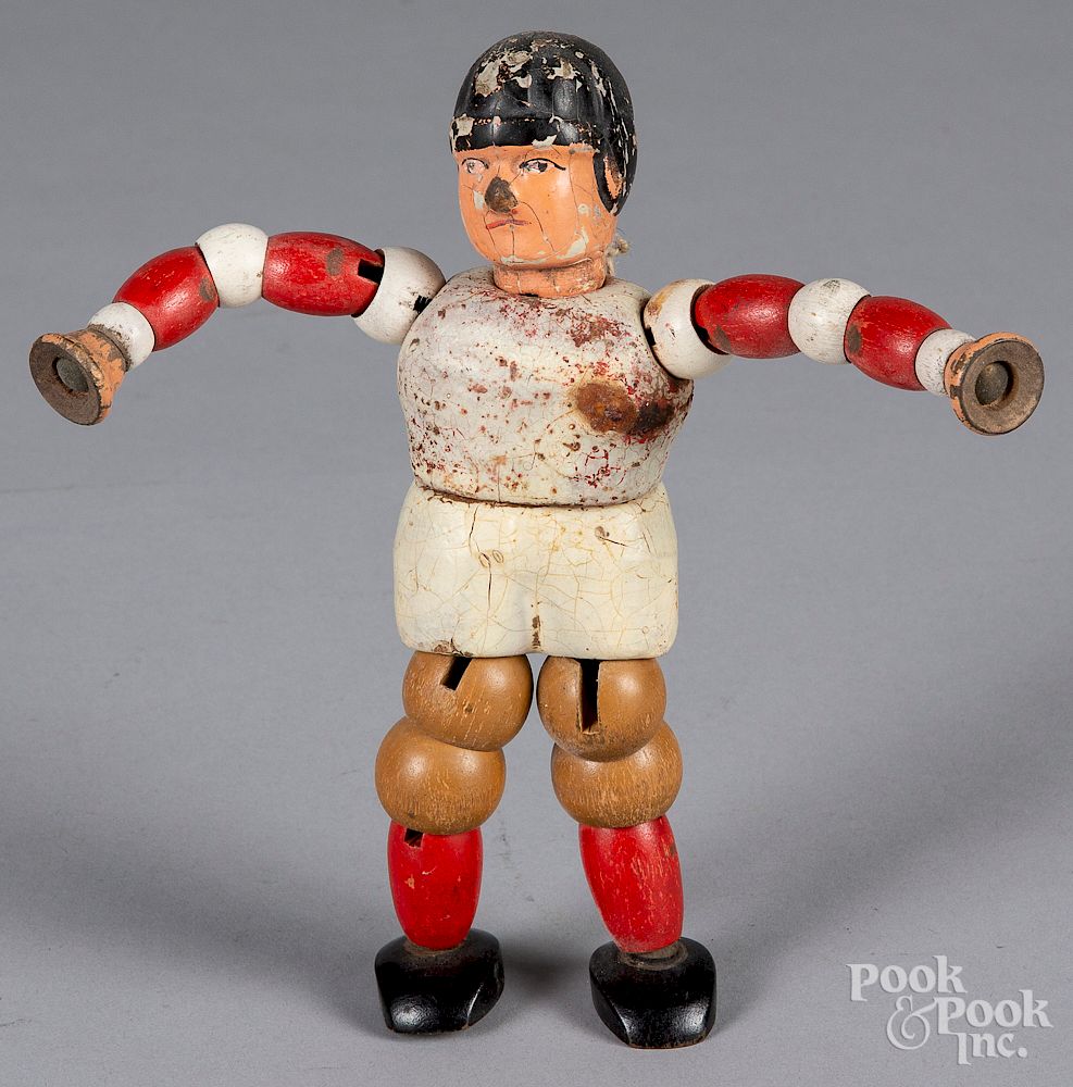 Appraisal: Twistum Toys jointed wood football player Twistum Toys jointed wood