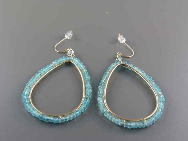 Appraisal: Blue Topaz Earrings large oval hoops k yellow gold ''