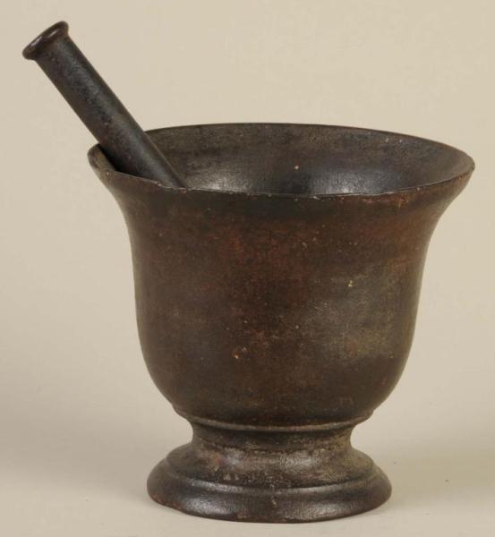 Appraisal: Cast Iron Mortar Pestle Description Chips to the upper lip