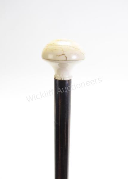 Appraisal: Compass Cane carved dome top handle unscrews to reveal a