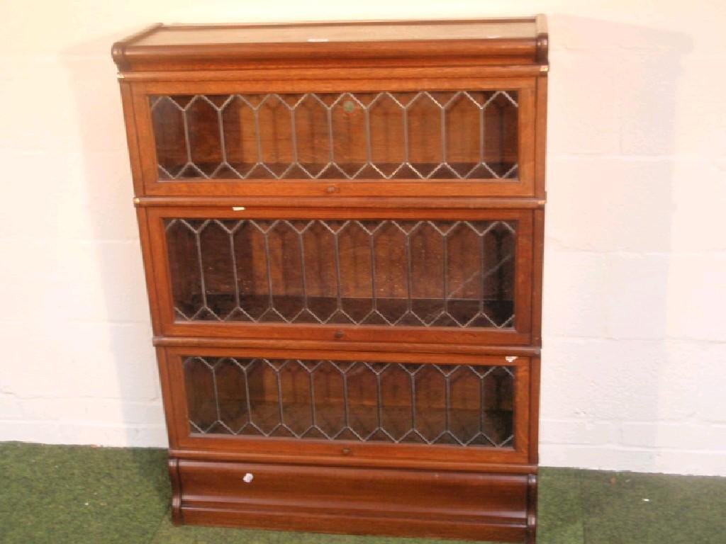 Appraisal: A Globe Wernicke three section stacking bookcase with leaded glazed