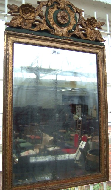 Appraisal: A th century green ground and parcel gilt wall mirror