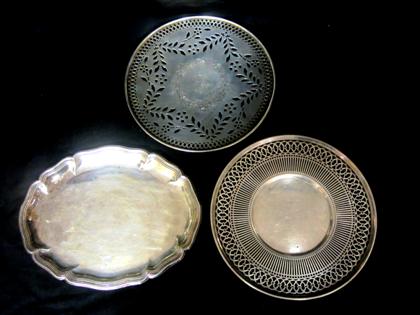 Appraisal: Two circular silver cake trays and a small oval chop