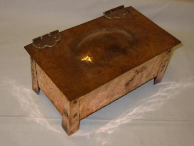 Appraisal: AN ARTS AND CRAFTS COPPER BOX of oblong spot hammered