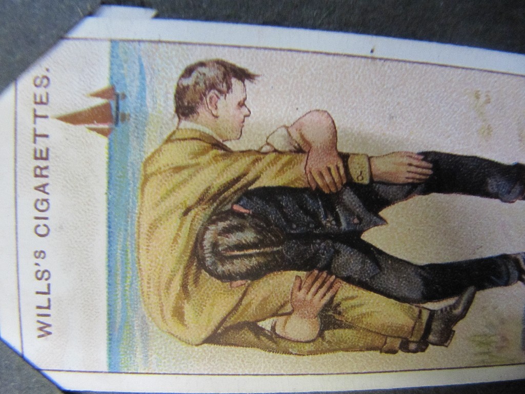 Appraisal: Lot comprising three albums of cigarette cards and a quantity