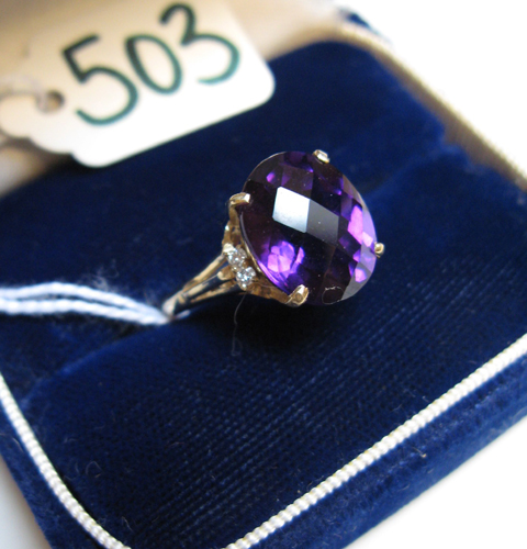 Appraisal: AMETHYST DIAMOND AND FOURTEEN KARAT GOLD RING Centered and prong