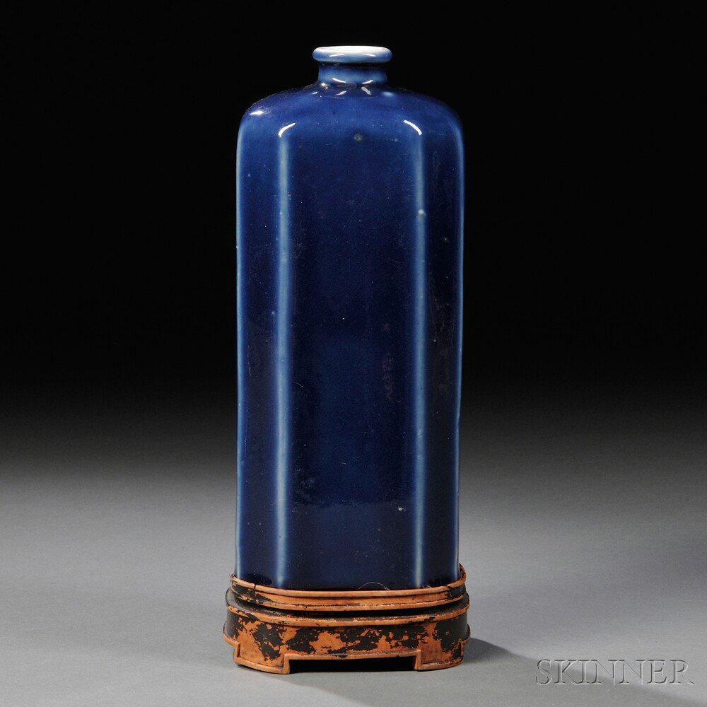 Appraisal: Blue-glazed Tall Bottle China th th century the elongated octagonal