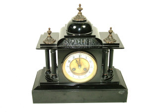 Appraisal: A lacquered black slate cased mantel clock of architectural form