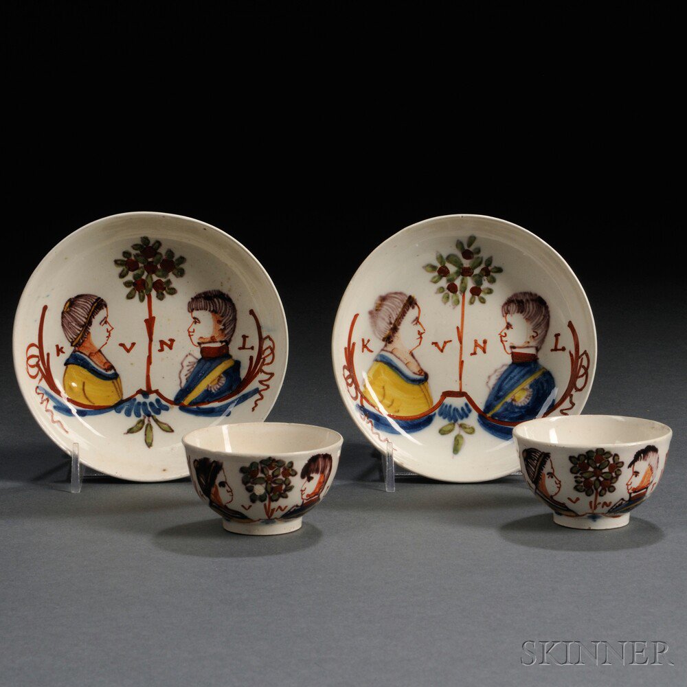 Appraisal: Pair of Dutch Decorated Cream-colored Earthenware Tea Bowls and Saucers