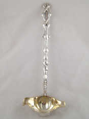 Appraisal: A white metal punch ladle with double lipped bowl and