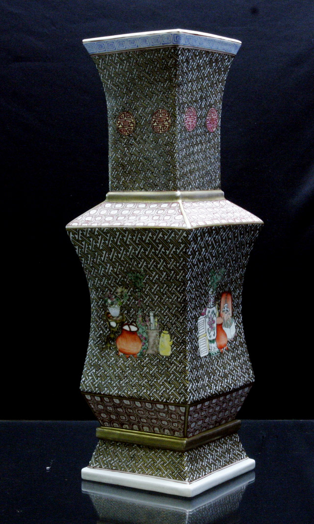 Appraisal: A facetted famille rose vase each side with a scene