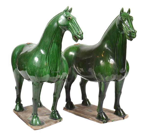 Appraisal: A PAIR OF GREEN GLAZED EARTHENWARE TANG STYLE HORSES cm