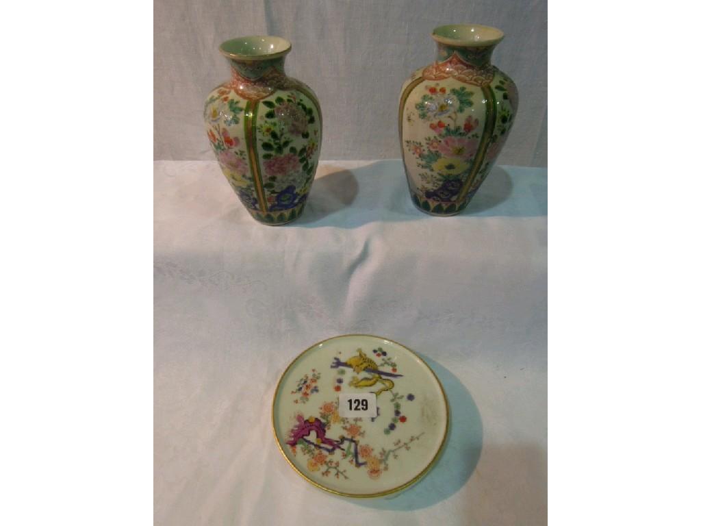 Appraisal: A pair of oriental vases with painted polychrome floral panels