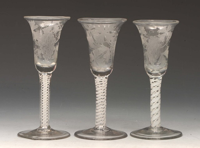 Appraisal: THREE COTTON TWIST STEM ALE GLASSES each with etched vine