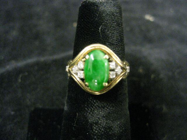 Appraisal: Jade Diamond Ring oval rich jade with four diamonds on