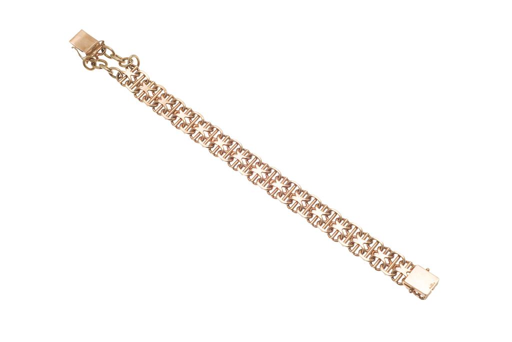 Appraisal: A ct gold bracelet of stylised scrolling design polished central