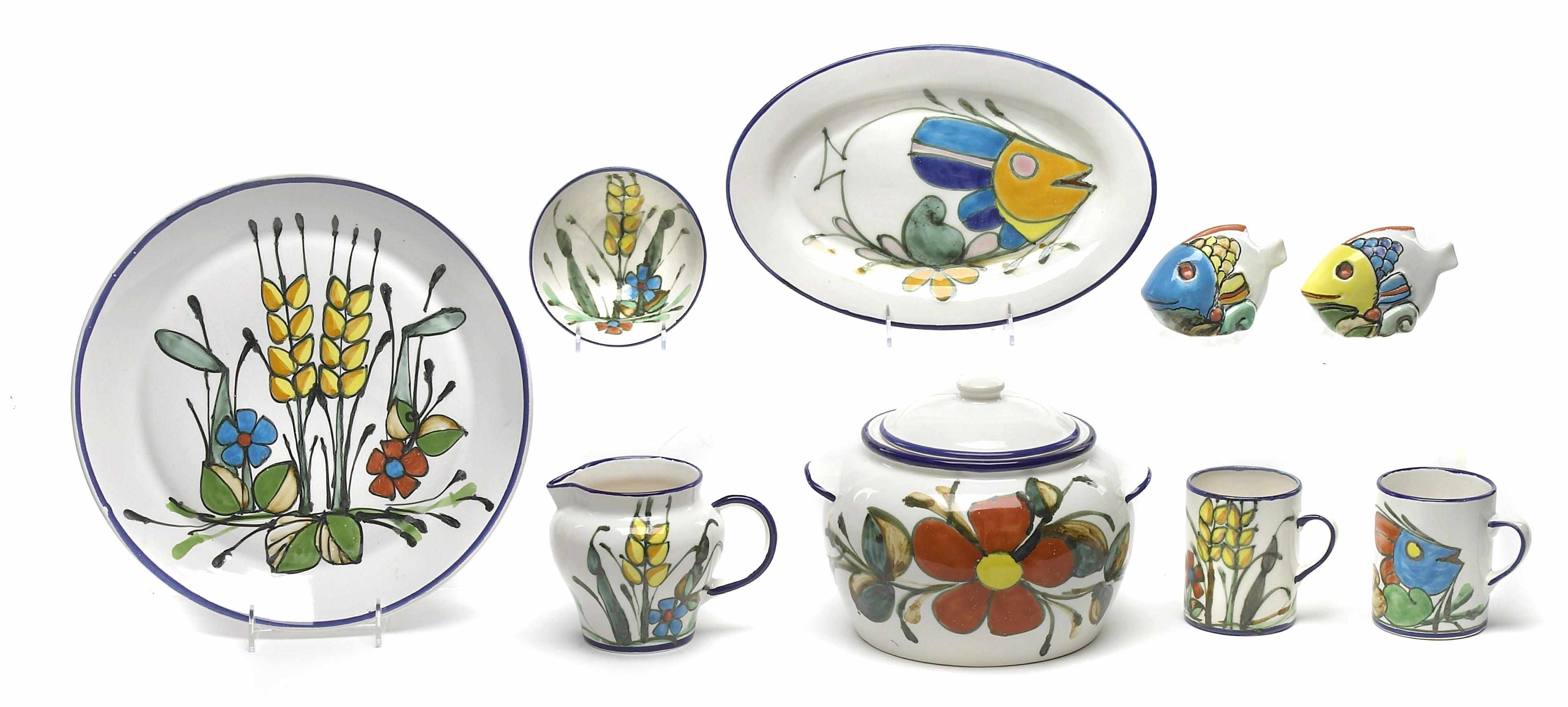 Appraisal: A paint decorated pottery part dinner service Comprising twelve in