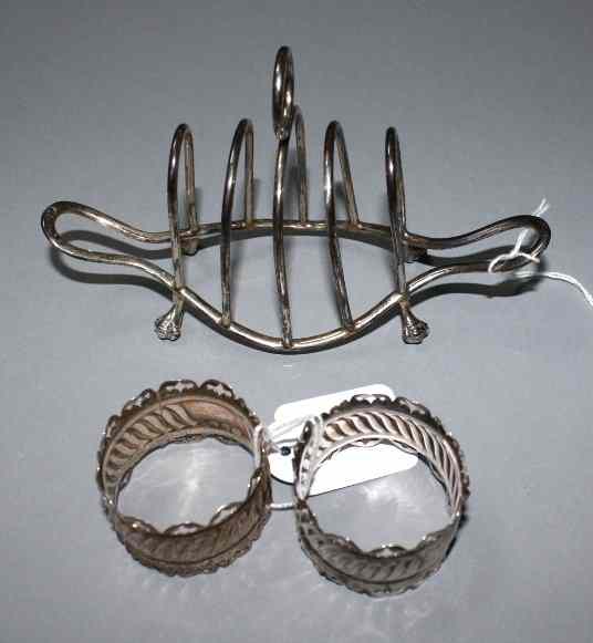 Appraisal: AN EDWARDIAN FOUR DIVISIONAL WIRE WORK TOAST RACK on shaped