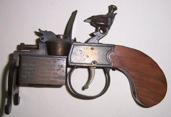 Appraisal: A table lighter in the form of a flintlock pistol