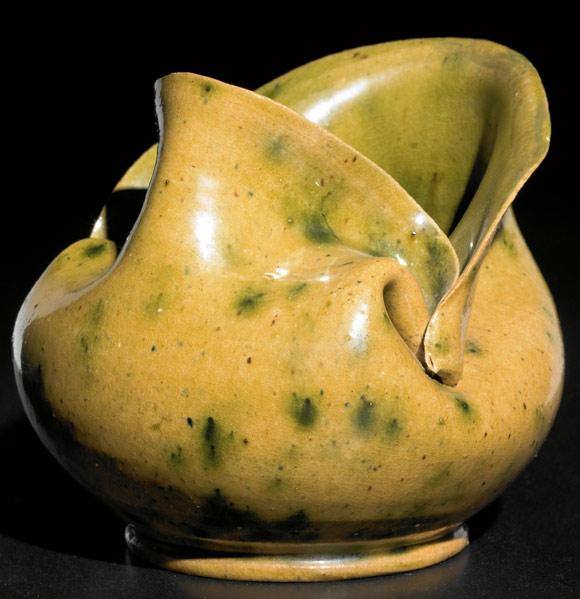 Appraisal: GEORGE OHR Pinched and folded vessel covered in green-speckled amber