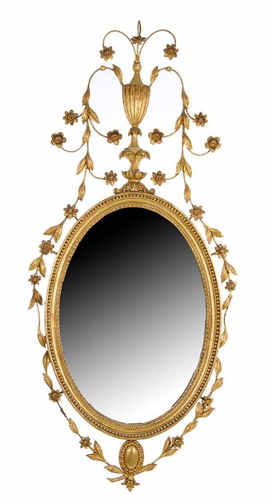 Appraisal: Pair Adam style oval giltwood mirrors early th century urn