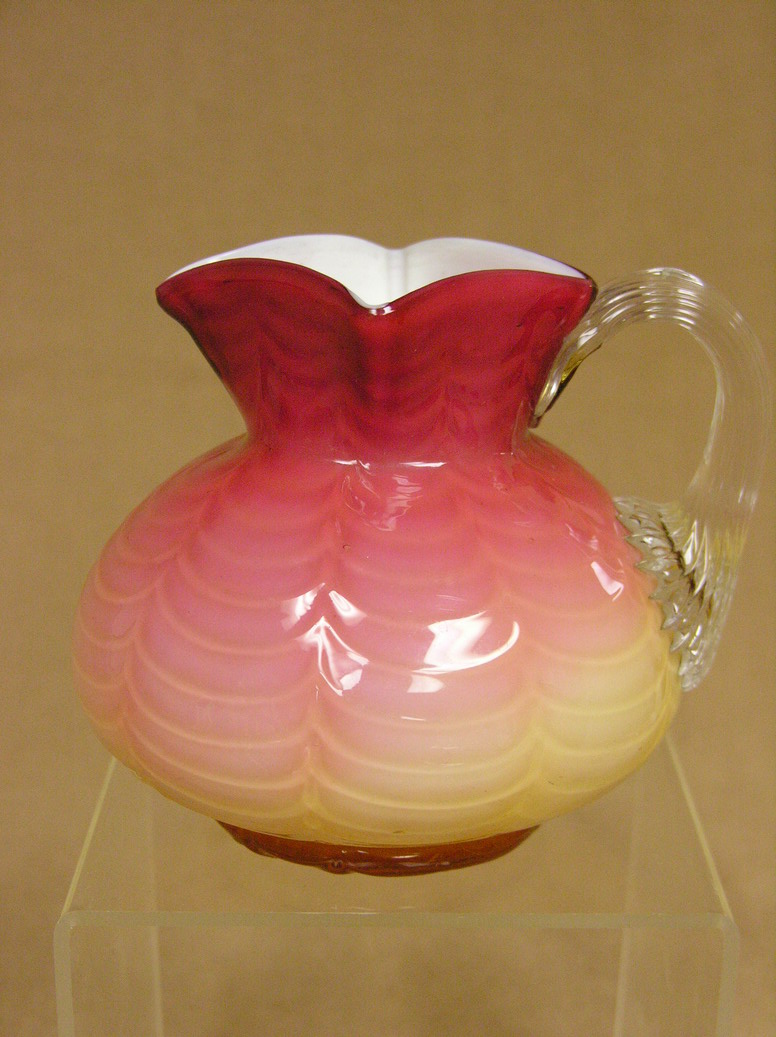 Appraisal: WHEELING PEACH BLOW PITCHER square top drape pattern glossy applied