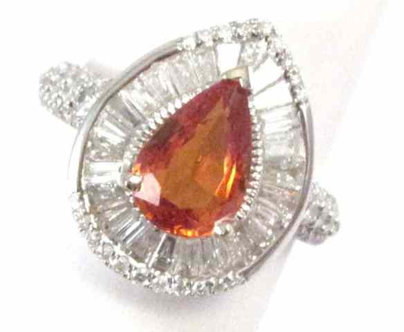 Appraisal: ORANGE SAPPHIRE AND DIAMOND RING k white gold with tapered