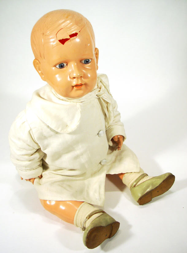 Appraisal: s German celluloid doll with jointed body and painted glass