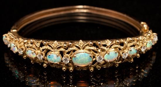 Appraisal: Lady's K yellow gold diamond and opal bangle bracelet grams