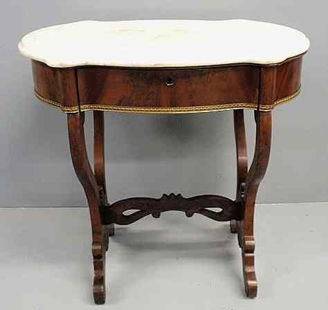 Appraisal: Empire mahogany table with a shaped marble top single drawer