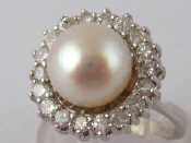 Appraisal: A white metal tests carat gold cultured pearl and diamond