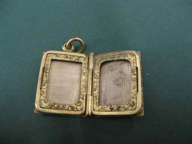 Appraisal: Victorian Gold Book Locket finely engravedfloral circa 's grams ''