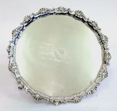 Appraisal: A GEORGE III SALVER of circular form the Chippendale border