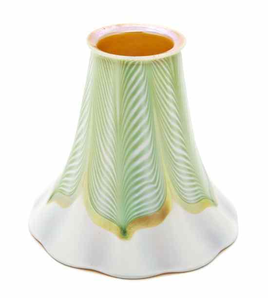 Appraisal: A Quezal Iridescent Glass Shade of floriform in green on