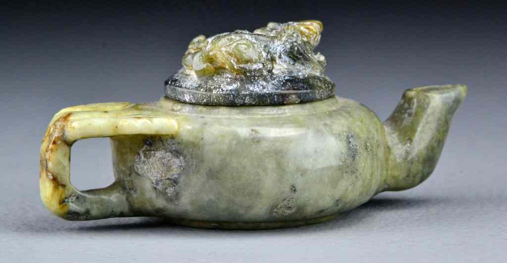 Appraisal: Chinese Qing Carved Jade Tea PotThe lid carved to depict