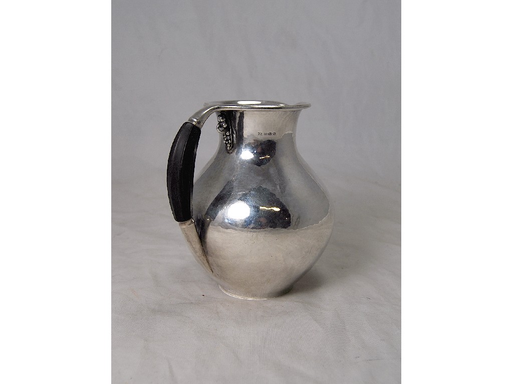 Appraisal: A 's Georg Jensen hot milk jug designed by Georg