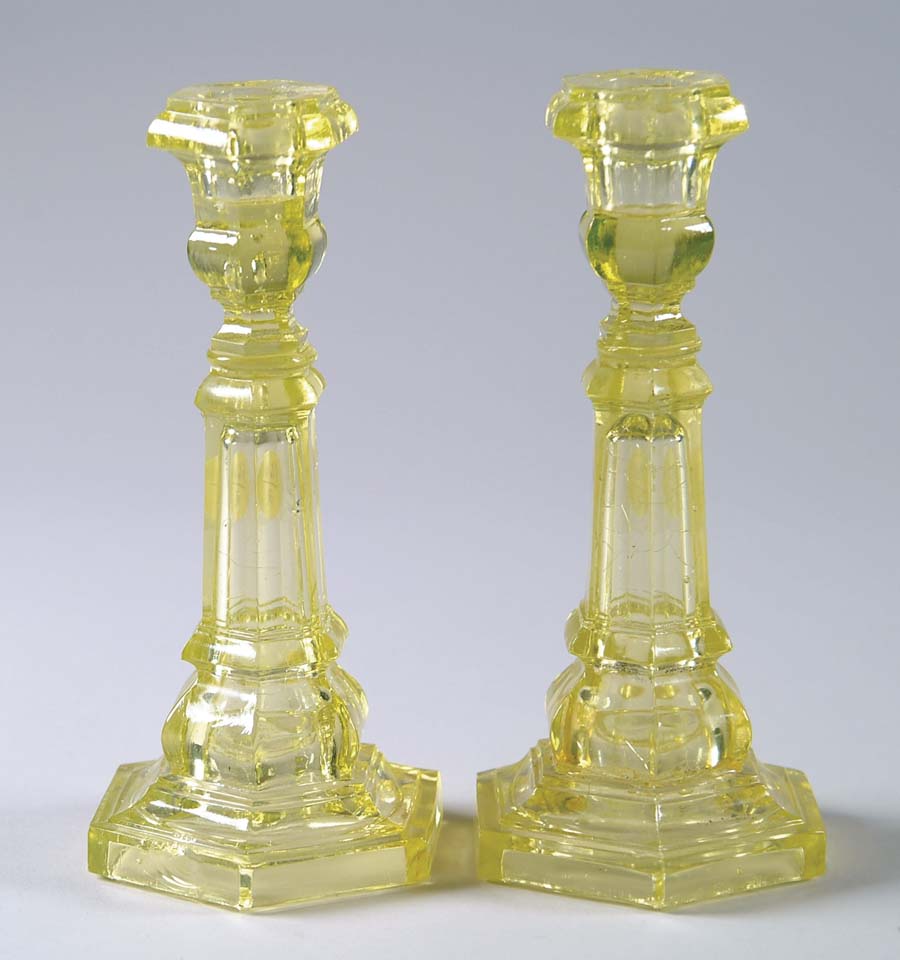 Appraisal: PAIR OF CANARY HEXAGONAL BASE COLUMN CANDLESTICKS Conforming hexagonal tops