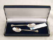 Appraisal: A pair of Millenium hallmarked teaspoons by Francis Howden Sheffield