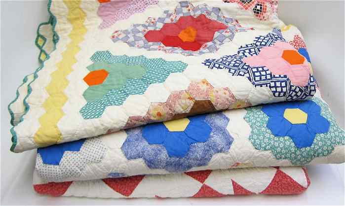 Appraisal: THREE VINTAGE AMERICAN HAND CRAFTED BED QUILTS a colorful floral