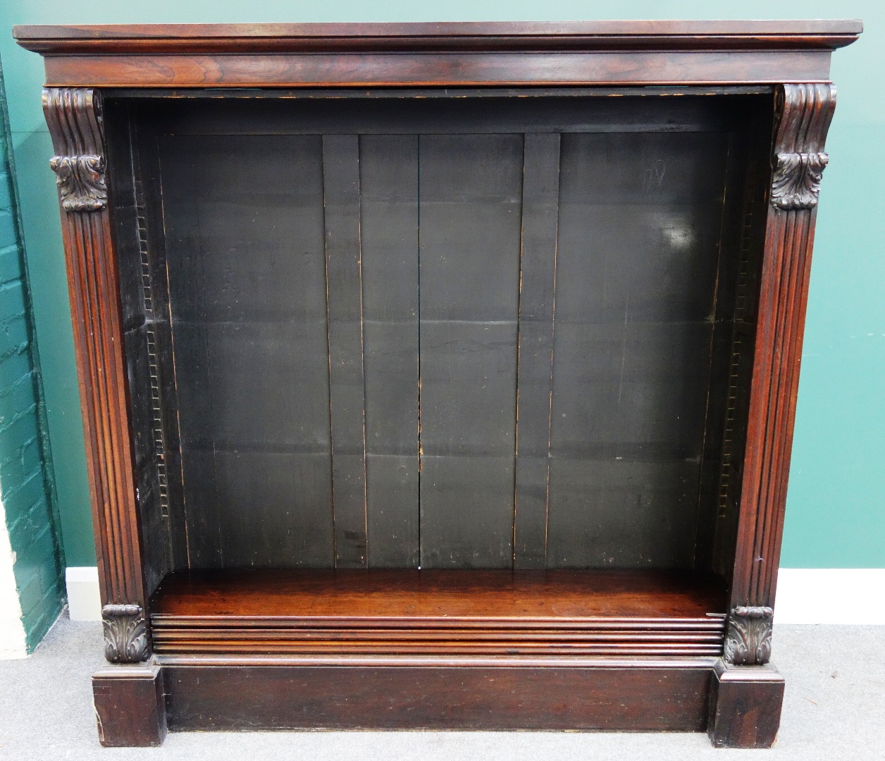 Appraisal: A Victorian rosewood floor standing open bookcase with scroll mounts